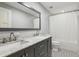 Bathroom featuring double vanity with marble countertop, and a shower/tub combo at 1382 6Th Ave, Auburn, GA 30011