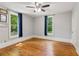 Empty bedroom with hardwood floors, plenty of natural light, and neutral walls at 1382 6Th Ave, Auburn, GA 30011