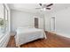 Bedroom showcasing hardwood floors, natural light, and access to additional rooms at 1382 6Th Ave, Auburn, GA 30011