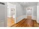 Foyer featuring hardwood floors, wood trim, and an open entryway to other rooms at 1382 6Th Ave, Auburn, GA 30011