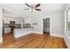 Kitchen and living space with hardwood flooring and new appliances at 1382 6Th Ave, Auburn, GA 30011
