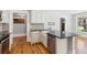 Modern kitchen featuring granite countertops, a stainless steel dishwasher and a farmhouse style sink at 1382 6Th Ave, Auburn, GA 30011