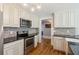 Bright kitchen with stainless steel appliances, granite countertops, and tile backsplash at 1382 6Th Ave, Auburn, GA 30011