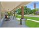 Inviting covered porch with seating, showcasing wooden pillars and serene views of the neighborhood, ideal for relaxing outdoors at 1382 6Th Ave, Auburn, GA 30011