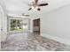 Spacious sunroom features herringbone floors, large windows, and a glimpse into the laundry area at 1382 6Th Ave, Auburn, GA 30011