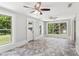 Bright sunroom with herringbone tile floors, white trim, and large windows overlooking the lawn at 1382 6Th Ave, Auburn, GA 30011