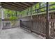 View of the covered patio and its wooden fencing showing the outdoor wooded area at 1603 Cumberland Ct, Smyrna, GA 30080