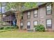 Exterior view of the two-story apartment building with private balconies and landscaped grounds at 1603 Cumberland Ct, Smyrna, GA 30080