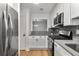 Bright kitchen features modern stainless steel appliances and classic white cabinetry at 1603 Cumberland Ct, Smyrna, GA 30080