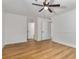 A spacious main bedroom with modern ceiling fan, laminate floors, and updated trim offers a serene and inviting space at 1603 Cumberland Ct, Smyrna, GA 30080