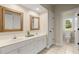 Bathroom with a double vanity, tile floors, and separate toilet room at 411 Hickory Fairway Ct, Woodstock, GA 30188