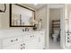 Bathroom with a granite vanity, stylish mirror, and walk in shower at 411 Hickory Fairway Ct, Woodstock, GA 30188