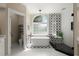 Updated bathroom with a soaking tub, walk-in shower, and modern fixtures at 411 Hickory Fairway Ct, Woodstock, GA 30188