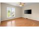 Bedroom with light filled window and modern ceiling fan at 411 Hickory Fairway Ct, Woodstock, GA 30188