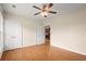 Bedroom featuring a ceiling fan and double door closet at 411 Hickory Fairway Ct, Woodstock, GA 30188