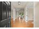 Inviting foyer with hardwood floors, high ceilings, and an arched window view at 411 Hickory Fairway Ct, Woodstock, GA 30188