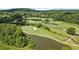 Scenic aerial view of the golf course with lush greens and water features at 411 Hickory Fairway Ct, Woodstock, GA 30188