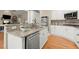 Modern kitchen featuring granite countertops, stainless steel appliances, and ample cabinet space for culinary enthusiasts at 411 Hickory Fairway Ct, Woodstock, GA 30188