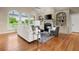 Bright living room with hardwood floors, built-in shelving, and a fireplace at 411 Hickory Fairway Ct, Woodstock, GA 30188