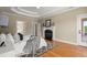 Spacious main bedroom with a fireplace, trey ceiling, and access to an outdoor deck at 411 Hickory Fairway Ct, Woodstock, GA 30188