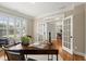 Well-lit home office with built-ins and French doors at 411 Hickory Fairway Ct, Woodstock, GA 30188