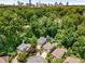 Aerial view of the property shows mature landscaping and close proximity to urban area at 1078 Shady Valley Ne Pl, Atlanta, GA 30324