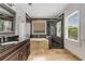 Bathroom features a soaking tub, walk in shower and dark brown vanity at 1078 Shady Valley Ne Pl, Atlanta, GA 30324