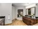 Bathroom features dark wood vanity and tiled floors at 1078 Shady Valley Ne Pl, Atlanta, GA 30324