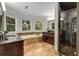 Bathroom featuring a soaking tub, glass shower and granite countertops at 1078 Shady Valley Ne Pl, Atlanta, GA 30324