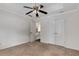 Neutral bedroom with a ceiling fan, carpet floors, and closet, offering a calming space at 1078 Shady Valley Ne Pl, Atlanta, GA 30324