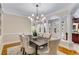 Formal dining room with hardwood floors, elegant chandelier, and seating for six at 1078 Shady Valley Ne Pl, Atlanta, GA 30324