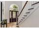 Foyer featuring a stylish front door, staircase, and elegant decor at 1078 Shady Valley Ne Pl, Atlanta, GA 30324