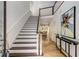 Bright foyer with hardwood floors, staircase, and view into the living space at 1078 Shady Valley Ne Pl, Atlanta, GA 30324