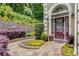 Landscaped front entrance with a stone pathway and a charming front door at 1078 Shady Valley Ne Pl, Atlanta, GA 30324