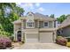 Attractive two-story home featuring a well-manicured lawn and a two-car garage at 1078 Shady Valley Ne Pl, Atlanta, GA 30324