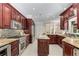 Large kitchen with stainless steel appliances, granite countertops, custom cabinets, and an island at 1078 Shady Valley Ne Pl, Atlanta, GA 30324