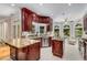 Well-equipped kitchen featuring custom cabinetry, granite countertops, tile backsplash, and an inviting breakfast nook at 1078 Shady Valley Ne Pl, Atlanta, GA 30324
