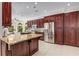 Gourmet kitchen features granite counters, custom cabinetry, stainless appliances, and breakfast area with pool views at 1078 Shady Valley Ne Pl, Atlanta, GA 30324