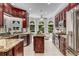 Spacious kitchen with stainless steel appliances, a granite island, and an adjacent breakfast area with outdoor views at 1078 Shady Valley Ne Pl, Atlanta, GA 30324