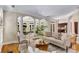 Open-concept living room with hardwood floors, fireplace, and lots of natural light at 1078 Shady Valley Ne Pl, Atlanta, GA 30324