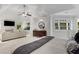 Spacious main bedroom with a seating area, fireplace, private balcony, and ample natural light at 1078 Shady Valley Ne Pl, Atlanta, GA 30324