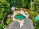 Aerial view of a backyard featuring a uniquely shaped pool, gazebo, patio, and lush landscaping at 1078 Shady Valley Ne Pl, Atlanta, GA 30324