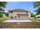 A spacious backyard featuring a well-maintained lawn and a concrete patio, perfect for entertaining at 1486 Rogers Crossing Dr, Lithonia, GA 30058