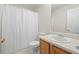 Functional bathroom with a single sink vanity and a shower with a white curtain at 1486 Rogers Crossing Dr, Lithonia, GA 30058
