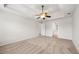 Bedroom featuring neutral carpet, white walls, and a modern ceiling fan at 1486 Rogers Crossing Dr, Lithonia, GA 30058