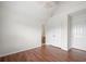The bedroom has wood floors, white walls, walk-in closet, and an ensuite bath at 1486 Rogers Crossing Dr, Lithonia, GA 30058