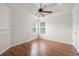 Bright bedroom showcases wood floors, a ceiling fan and recessed lights at 1486 Rogers Crossing Dr, Lithonia, GA 30058