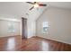 Large bedroom with hardwood floors and a ceiling fan at 1486 Rogers Crossing Dr, Lithonia, GA 30058
