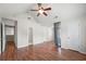 The bedroom features wood floors, white walls, and multiple entrances at 1486 Rogers Crossing Dr, Lithonia, GA 30058