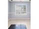 Bright dining room with a large window and neutral paint at 1486 Rogers Crossing Dr, Lithonia, GA 30058
